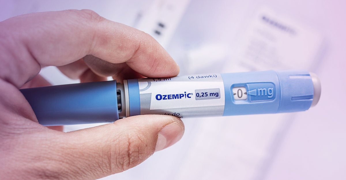 hand holding Ozempic injectable 